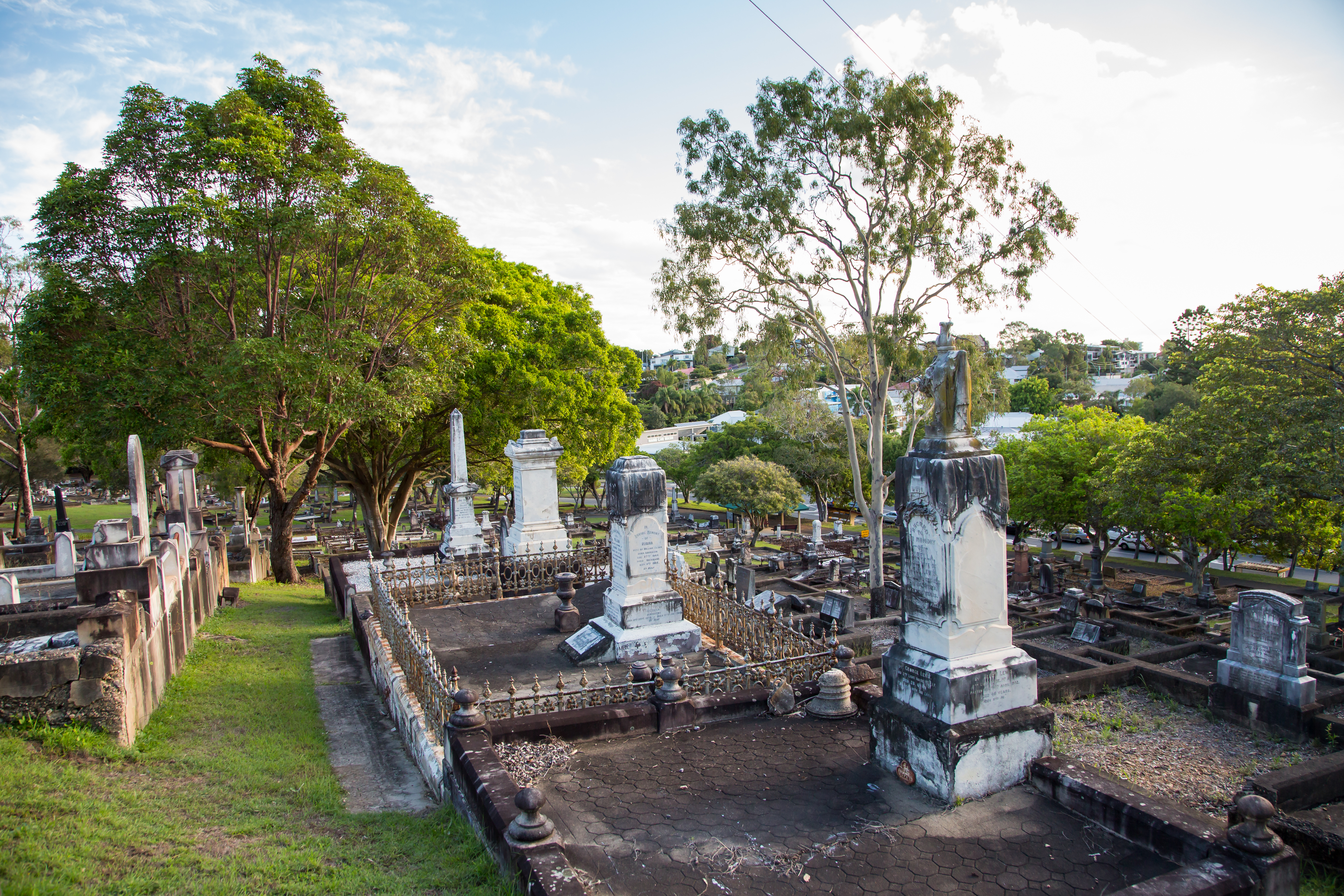 This is an image of Balmoral Cemetery showing headstones and trees.