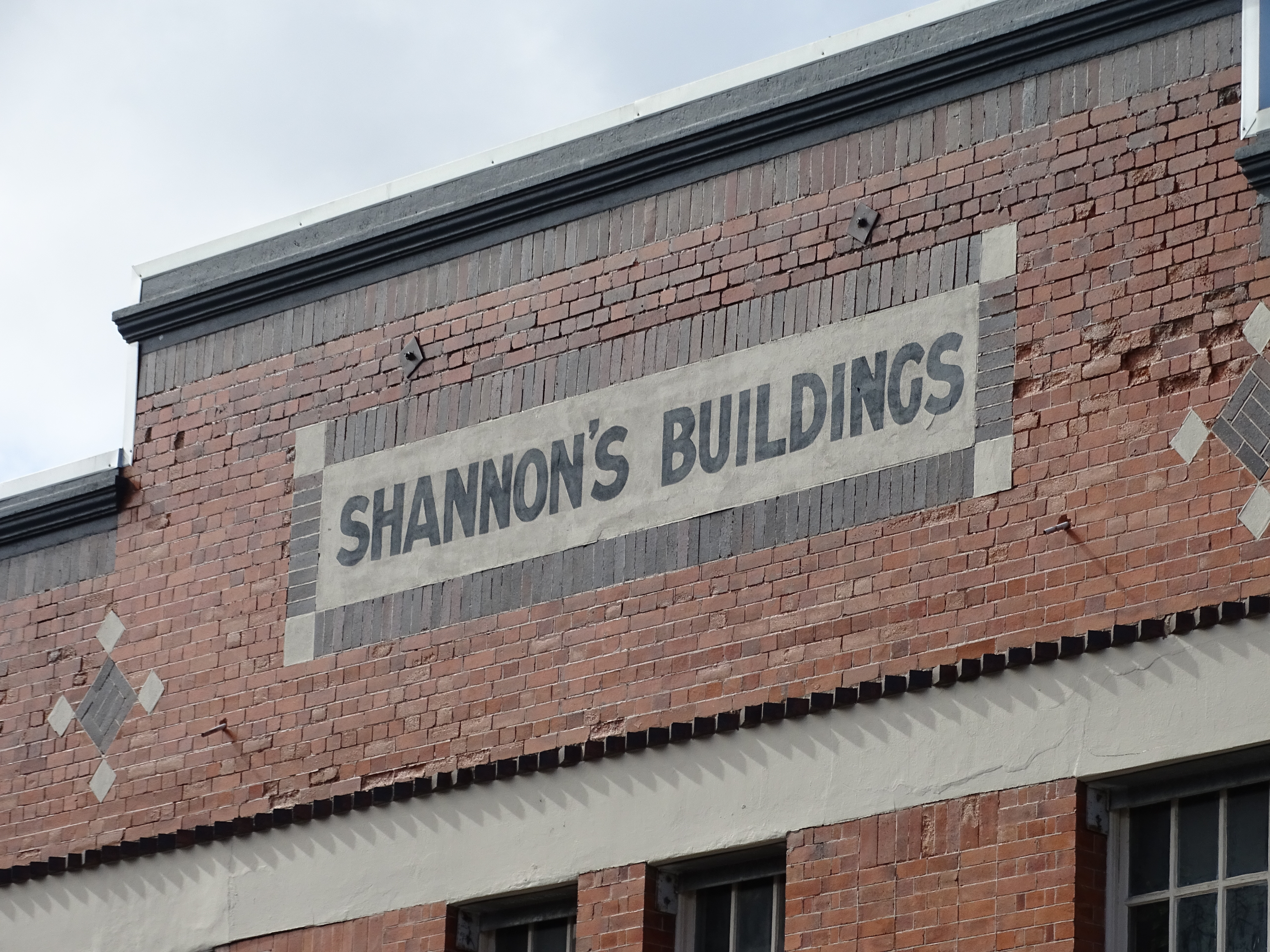 This is an image showing the detail of the parapet of the Heritage Place known as Shannon's Building, viewed from Ann Street.