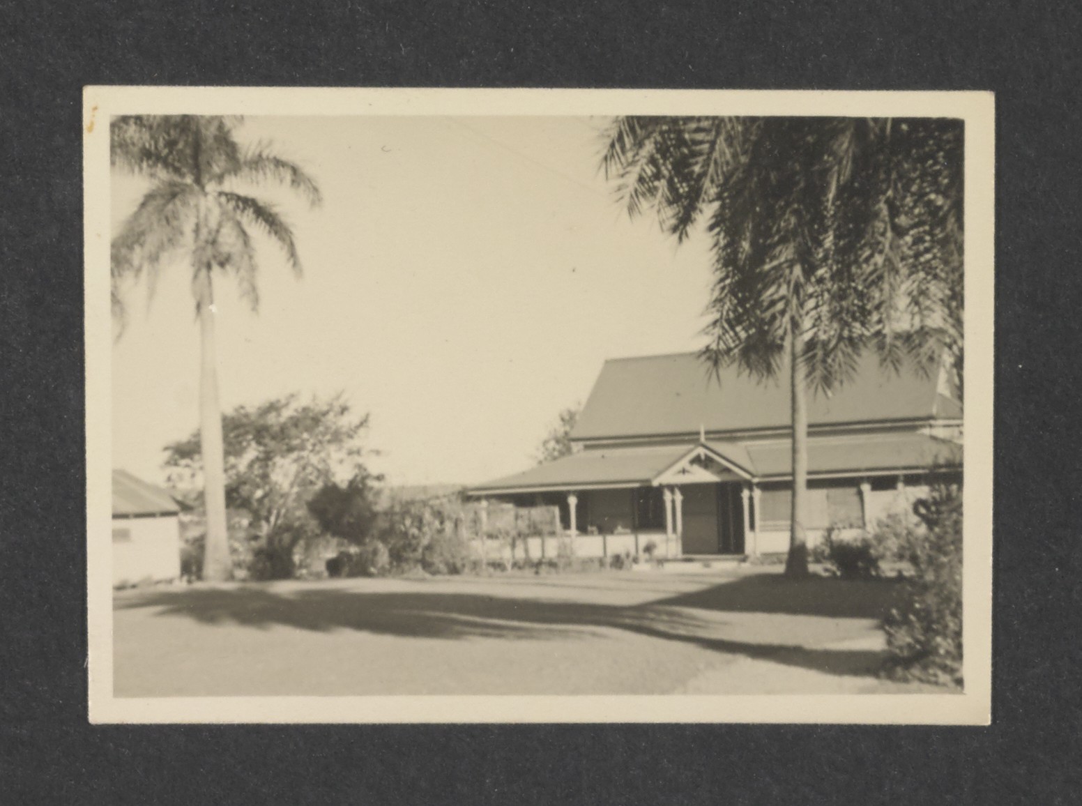 A historical photo of a house set in large grounds
