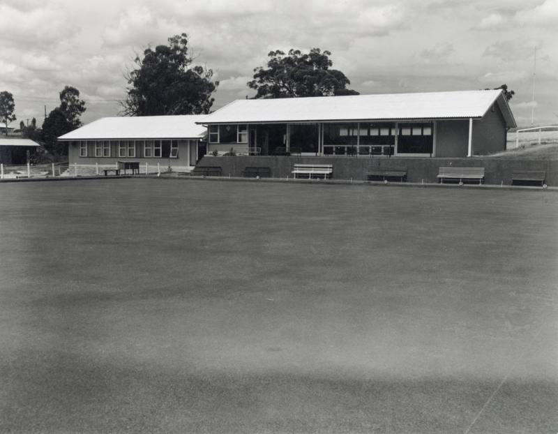 This is an image of ‘Balmoral Bowls Club, Morningside, Queensland’, c.1955-1975, viewed from Balmoral Park, Morningside, looking south.
