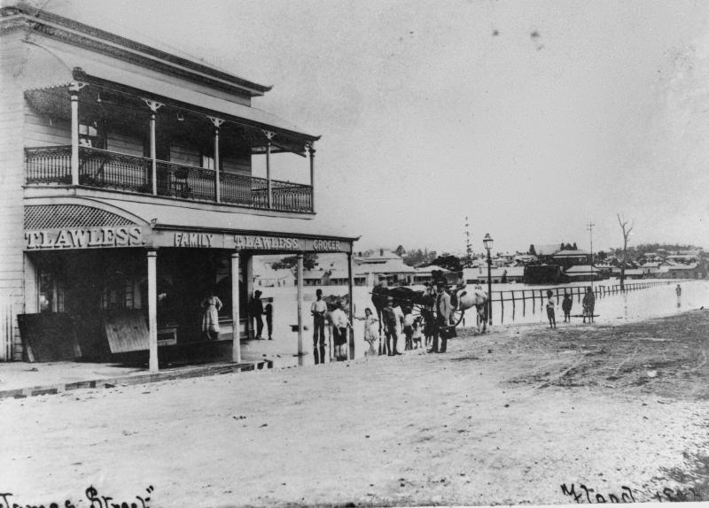 This is an image of ‘James Street, Fortitude Valley, during the 1893 Brisbane flood', viewed from the corner of James and Doggett streets, Fortitude Valley, looking west.