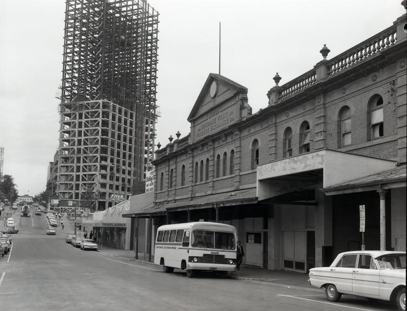 This is an image of ‘Turbot Street’, 1969, viewed from near the corner of Turbot and George streets, Brisbane, looking east.