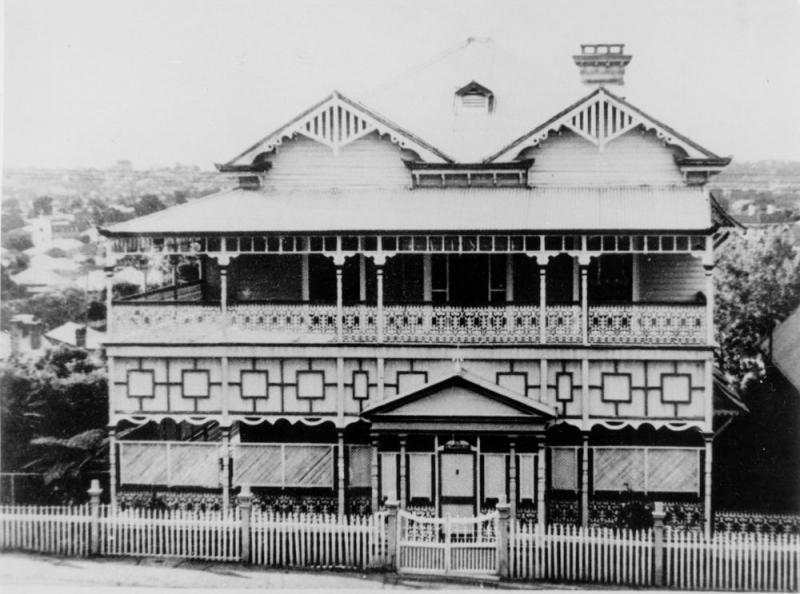 This is an image of 'Franklin Villa, a residence with distinctive decorations in Highgate Hill, Brisbane, ca.1928', undated, viewed from Brighton Road, Highgate Hill, looking north.