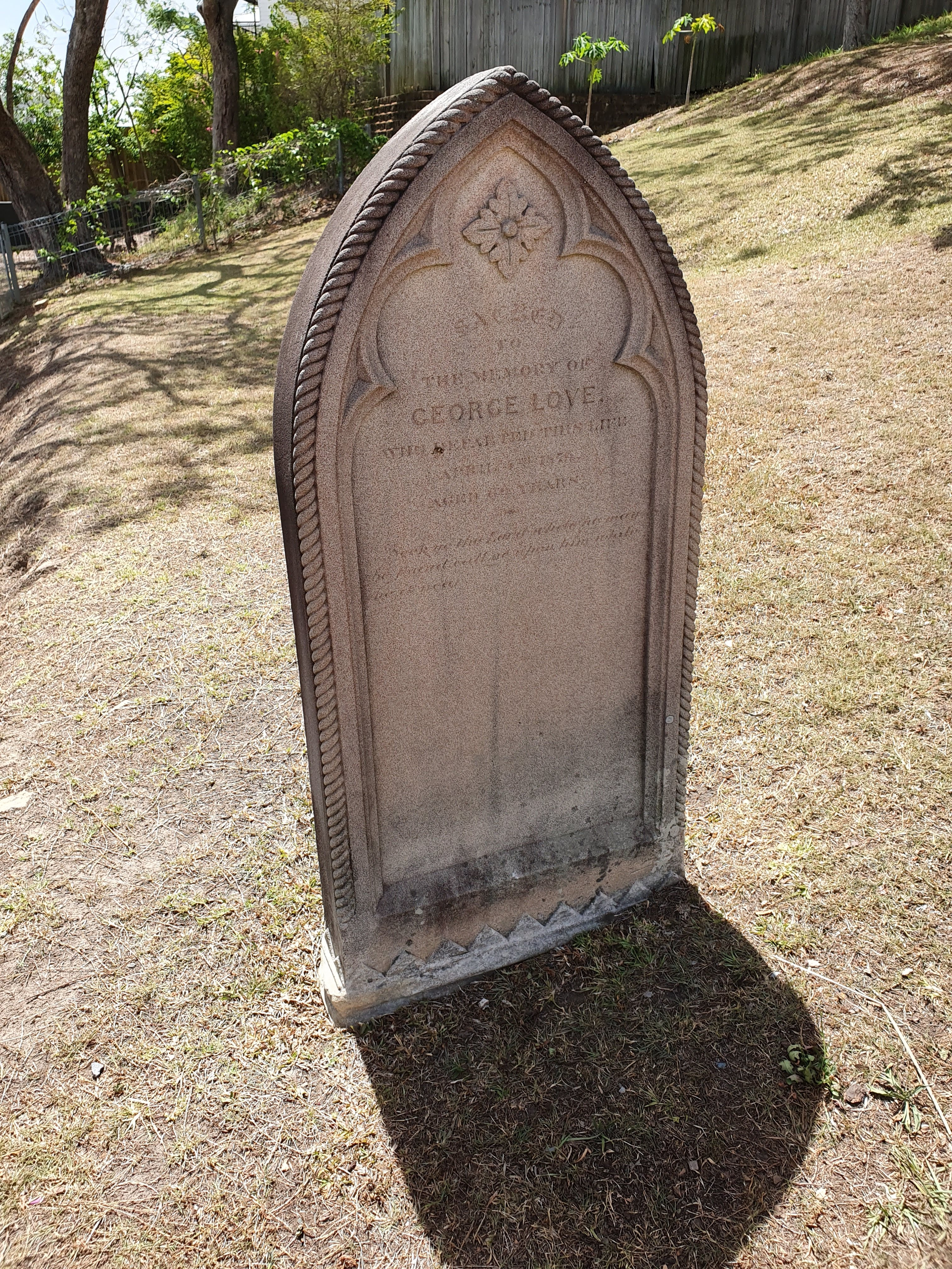 This is an image of a memorial to George Love located behind the Bulimba Uniting Church