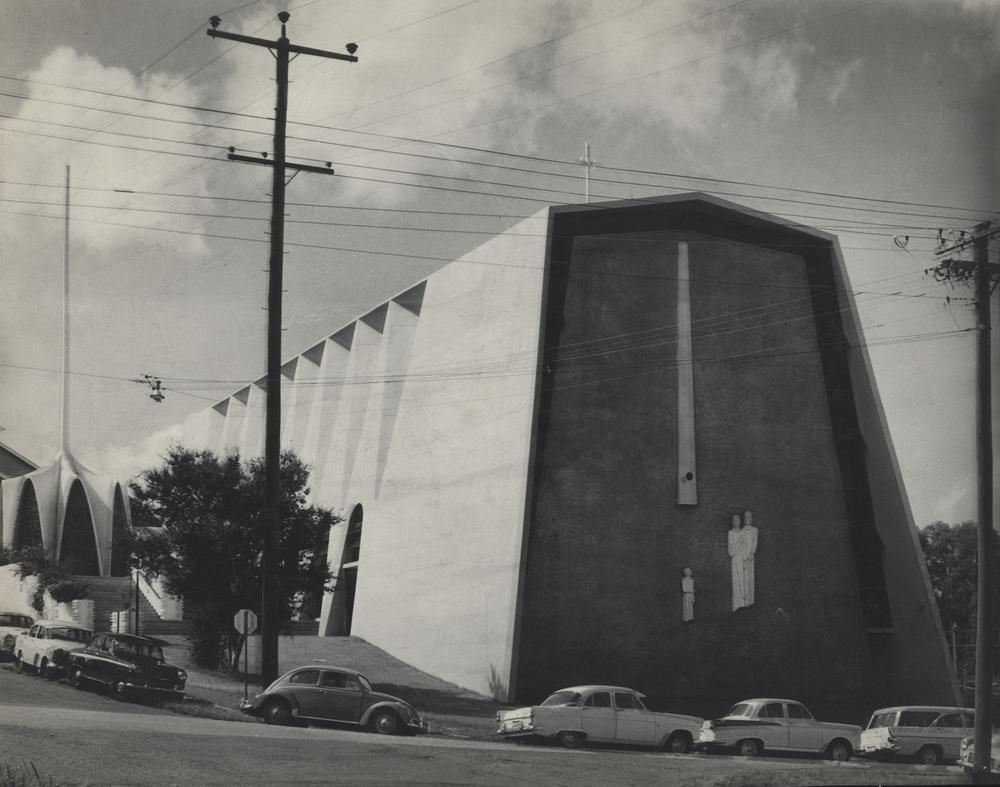 This is an image of ‘Holy Family Catholic Church at Indooroopilly, Queensland’, c.1963, viewed from the corner of Ward Street & Central Avenue, Indooroopilly, looking south-east