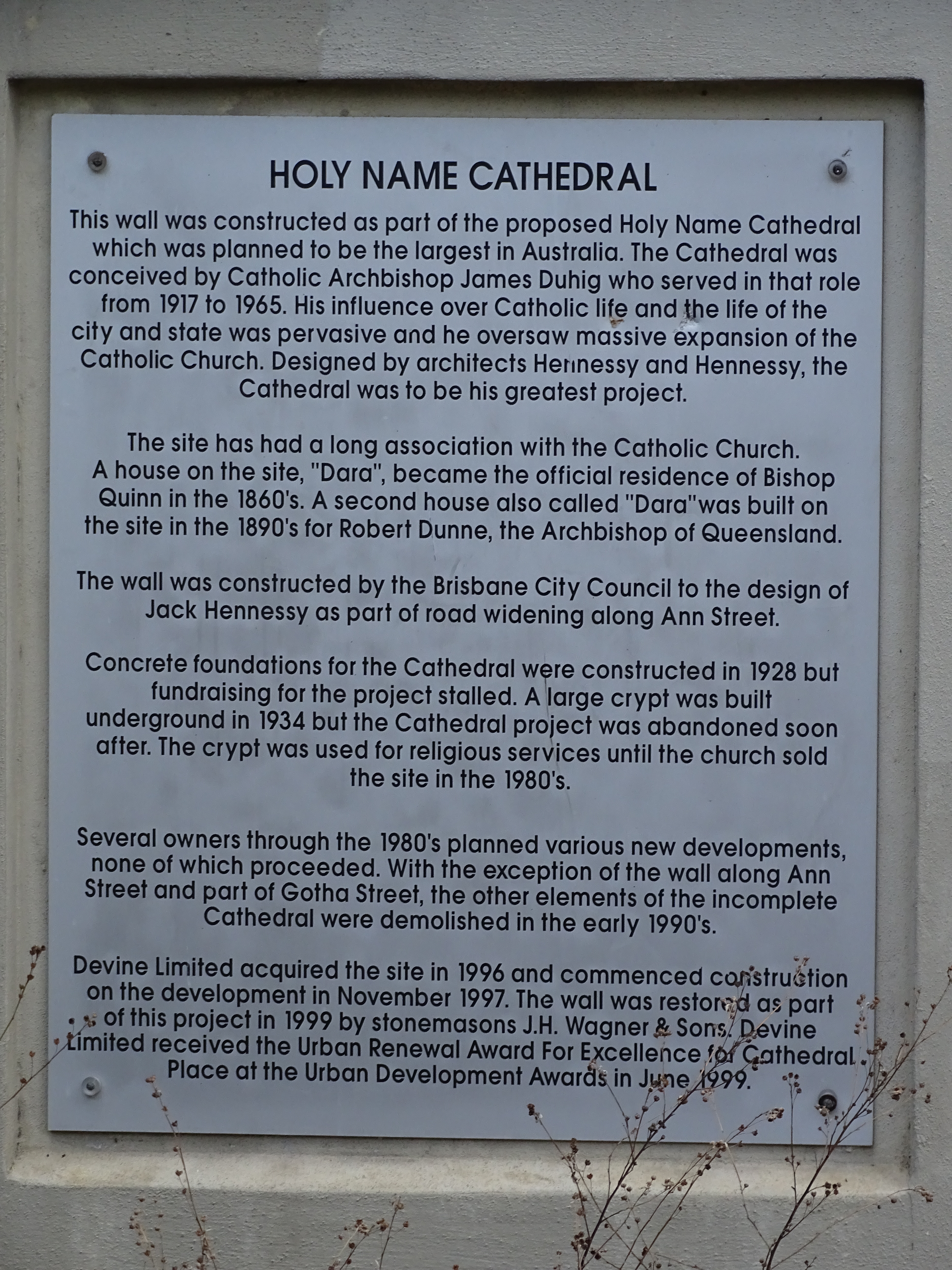 This is an image showing a plaque on the Heritage Place known as the Holy Name Cathedral site, viewed from Gotha Street.