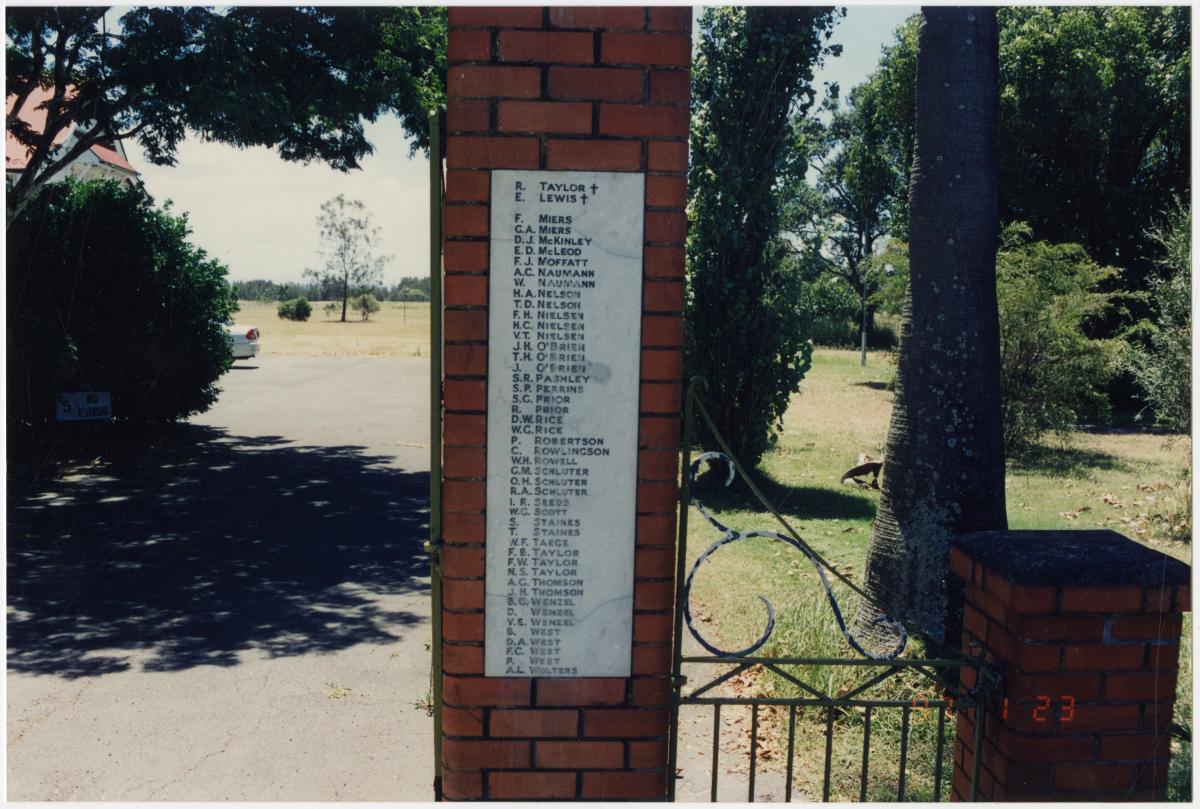 This is an image of the local heritage place known as Pinkenba State School. This image shows detail of the plaque on the right side of the memorial gates.