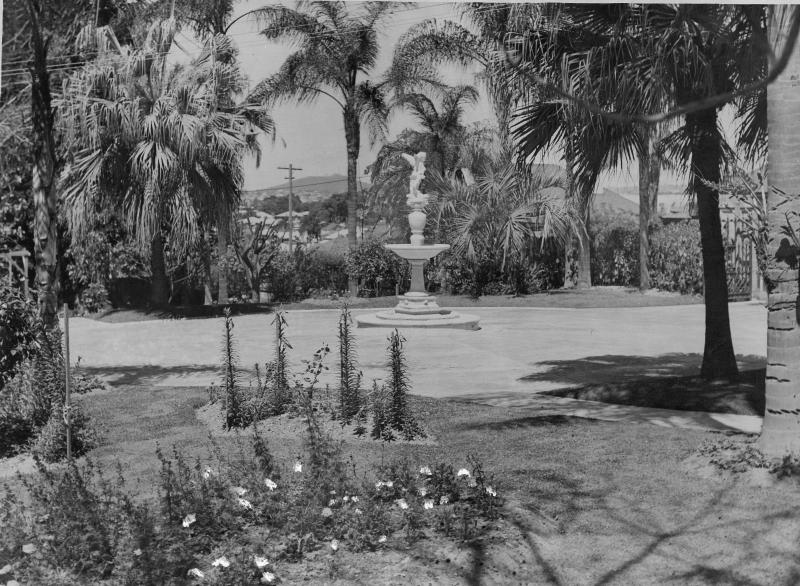 This is an image of ‘Fountain in the garden of Wynberg, New Farm, ca. 1940’, viewed from the garden, looking south.