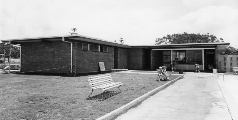 This is an image of 'Manly Swimming Pool and Amenities Block - Manly - 1964', 2 December 1964, showing a view of the amenities block from within the pool complex, looking south-west.
