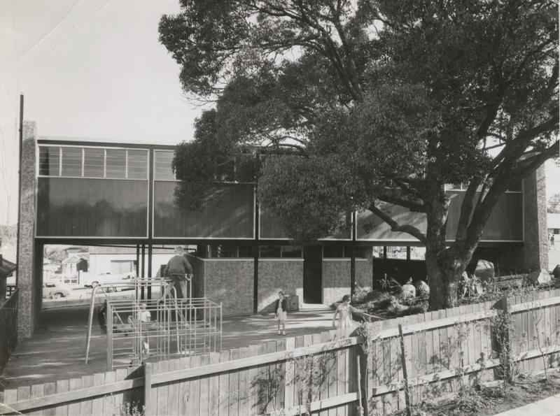 This is an image of ‘Exterior view of the Annerley Library, Queensland, ca. 1957’, viewed from the rear of the neighbouring Annerley Police Station (444 Annerley Road, Annerley), looking south.