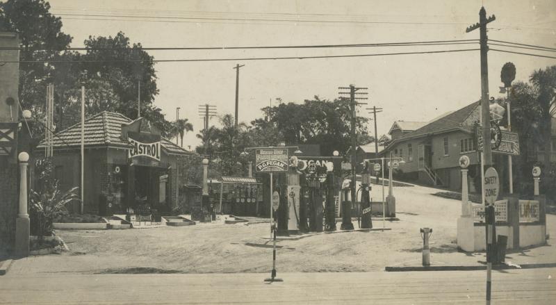 This is an image of ‘View of Pirie Grey Fegan's service station in Newstead, Queensland, ca. 1935', viewed from the corner of Breakfast Creek Road & Jordan Terrace, Newstead, looking west.