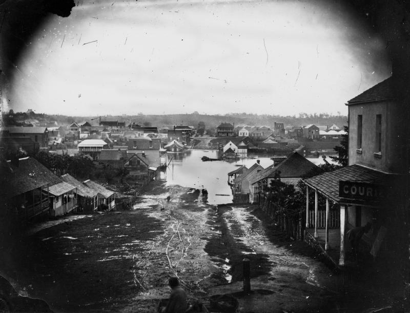 This is an image of 'Charlotte Street, Brisbane, during the 1864 flood', viewed from Charlotte & George streets, Brisbane, looking north.