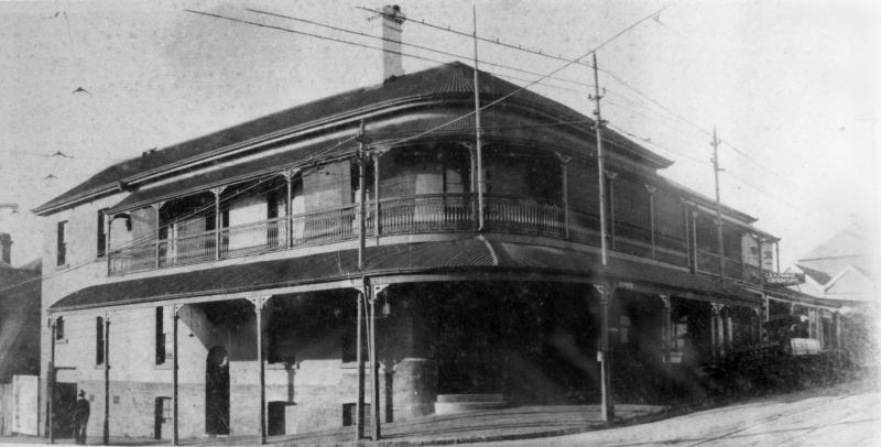 This is an image of ‘Prince Alfred Hotel, Brisbane, ca. 1929’, viewed from the corner of Petrie Terrace and Caxton Street, Petrie Terrace, looking north.