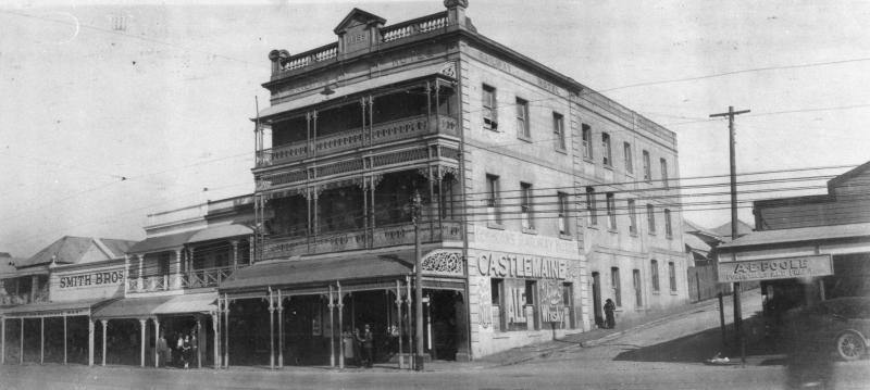 This is an image of ‘Railway Hotel at Woolloongabba, Brisbane, ca. 1929, viewed from the north-side of the corner of Stanley & Reid streets, Woolloongabba, looking south-east.