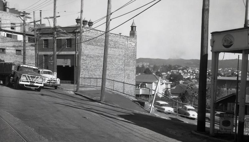 This is an image of ‘Brisbane Transport Substation No. 4 - Petrie Terrace - 1968’, looking south-west from the intersection of Petrie Terrace and Sheriff Street, Petrie Terrace.