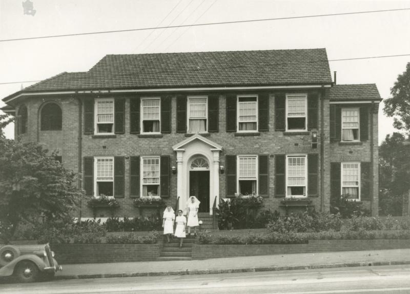 This is an image of 'Turrawan Hospital, Clayfield, 1948', looking south-east toward the front entrance from Sandgate Road.
