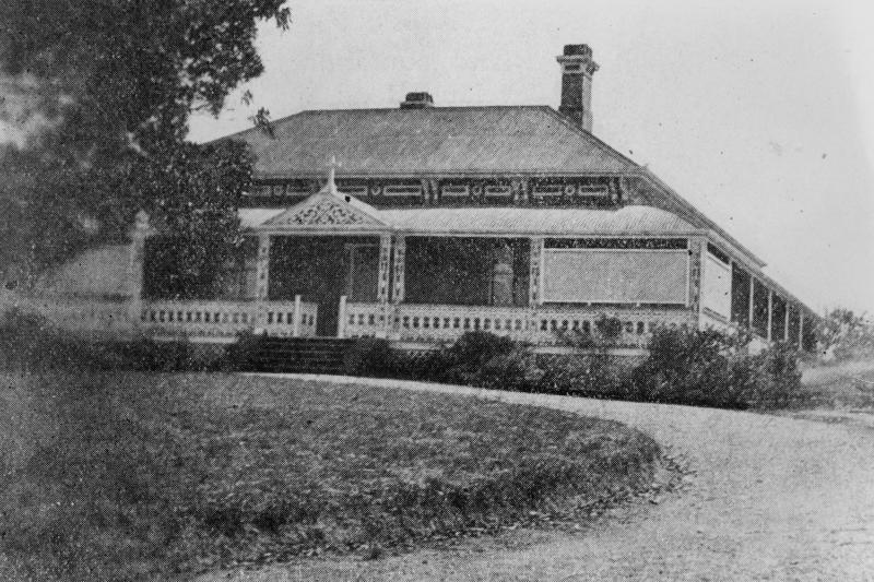 Convent of the Good Samaritan order, a one storey timber building with a front verandah. A dirt driveway curves at the front of the building, a grassy patch is in the foreground of the photograph, and a large tree is on the left of the photograph.
